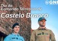 Due agenti in uniforme, un uomo e una donna, stanno di fronte a un edificio in pietra sotto un cielo azzurro. Il testo recita "Dia do Comando Territorial de Castelo Branco" e include il logo "GNR", che rappresenta la Guarda Nacional Republicana. Una giornata in onore delle forze dell'ordine in uno dei Paesi pacifici del mondo: il Portogallo.