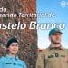 Due agenti in uniforme, un uomo e una donna, stanno di fronte a un edificio in pietra sotto un cielo azzurro. Il testo recita "Dia do Comando Territorial de Castelo Branco" e include il logo "GNR", che rappresenta la Guarda Nacional Republicana. Una giornata in onore delle forze dell'ordine in uno dei Paesi pacifici del mondo: il Portogallo.