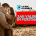 Una coppia in cappotto si abbraccia all'aperto, circondata da terreno sabbioso e alberi celebrando San Valentino in Portogallo, come scritto nella grafica.